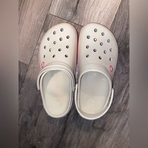 Creme color with pink crocs